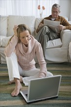 Couple relaxing in livingroom.