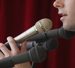 Man speaking into microphone.