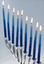 Close up of menorah with lit candles. Date : 2008