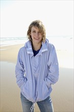 Woman standing on beach. Date : 2008