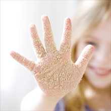 Girl with sand on hand. Date : 2008