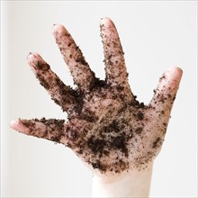 Close up of soil on child’s hand. Date : 2008
