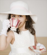 Hispanic girl dressed up at tea party. Date : 2008