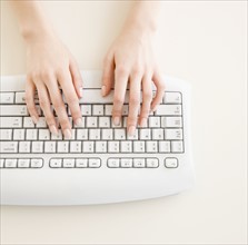 Woman typing on computer. Date : 2008