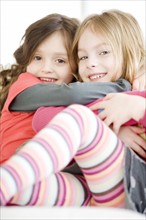 Close up of sisters hugging. Date : 2008