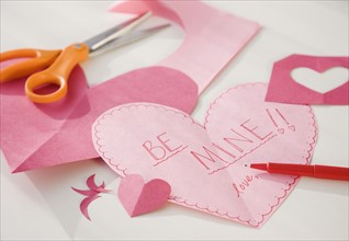 Home-made valentine next to scissors. Date : 2008