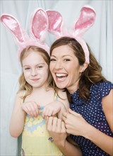 Mother and daughter wearing rabbit ears. Date : 2008