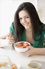 Woman eating cereal. Date : 2008