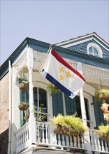Low angle view of flag on balcony, French Quarter, New Orleans, Louisiana, United States. Date :