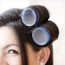 Close up of curlers in woman’s hair. Date : 2008