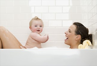 Mother and baby in bathtub. Date : 2008