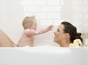 Mother and baby in bathtub. Date : 2008