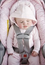 Baby sleeping in car seat. Date : 2008