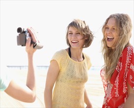 Women being filmed on beach. Date : 2008