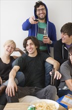 Group of friends watching television. Date : 2008