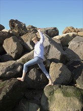 Woman climbing on rocks. Date : 2008