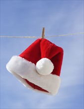 Santa Claus hat hanging on clothesline. Date : 2008