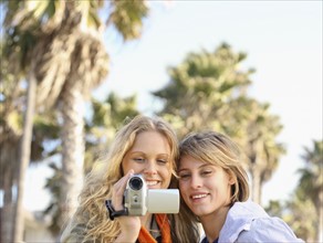 Two women looking at video camera. Date : 2008