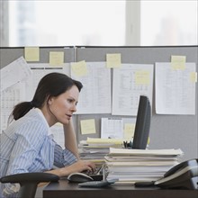 Businesswoman looking at computer.