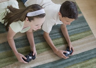 Brother and sister playing video games.