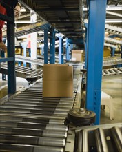 Boxes on conveyor belt in warehouse. Date : 2008
