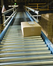 Package on conveyor belt in warehouse. Date : 2008