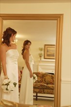 Bride looking in mirror. Date : 2008
