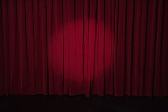 Spotlight on stage curtain. Date : 2008