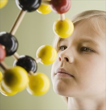 Boy looking at molecular model. Date : 2008