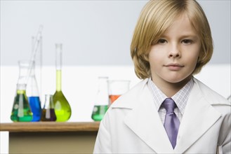 Boy in front of science beakers. Date : 2008