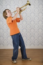 Boy playing trumpet. Date : 2008