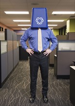 Businessman with recycling bin on head. Date : 2008