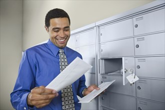 African businessman reading mail. Date : 2008