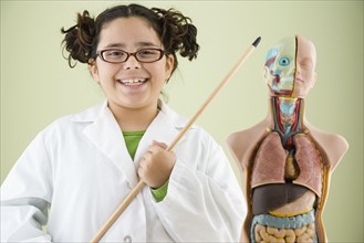 Girl pointing at human anatomy model. Date : 2008