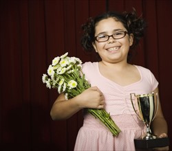 Girl holding flowers and trophy. Date : 2008