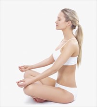 Woman in underwear meditating. Date : 2008