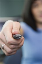 Woman holding USB drive. Date : 2008