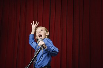 Boy singing on stage. Date : 2008