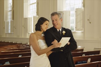Bride and father reading letter. Date : 2008