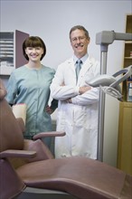 Dentist and dental hygienist in office. Date : 2008