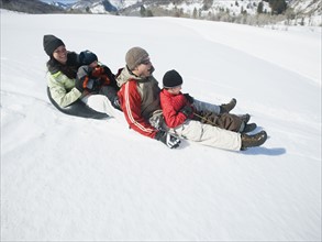 Family riding on sled. Date : 2008