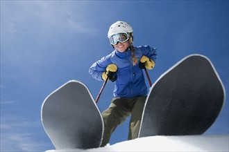 Low angle view of woman on skis. Date : 2008
