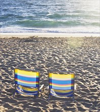Empty beach chairs on sand. Date : 2008