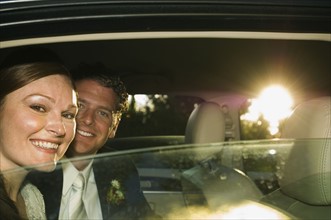 Bride and groom in limousine. Date : 2008