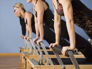 Women exercising in pilates class. Date : 2008