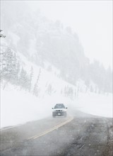 Car driving on snow road, Wasatch Mountains, Utah, United States. Date : 2008