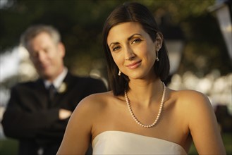 Bride with father in background. Date : 2008