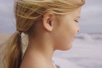 Profile of girl at beach. Date : 2008