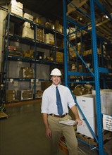 Warehouse worker with clipboard. Date : 2008