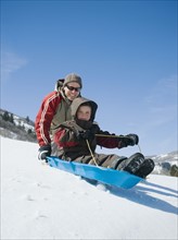 Father and son on sled. Date : 2008
